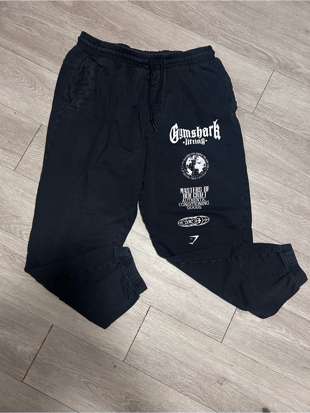 Gymshark Black Sweat Joggers with White Graphic Logos distressed wash